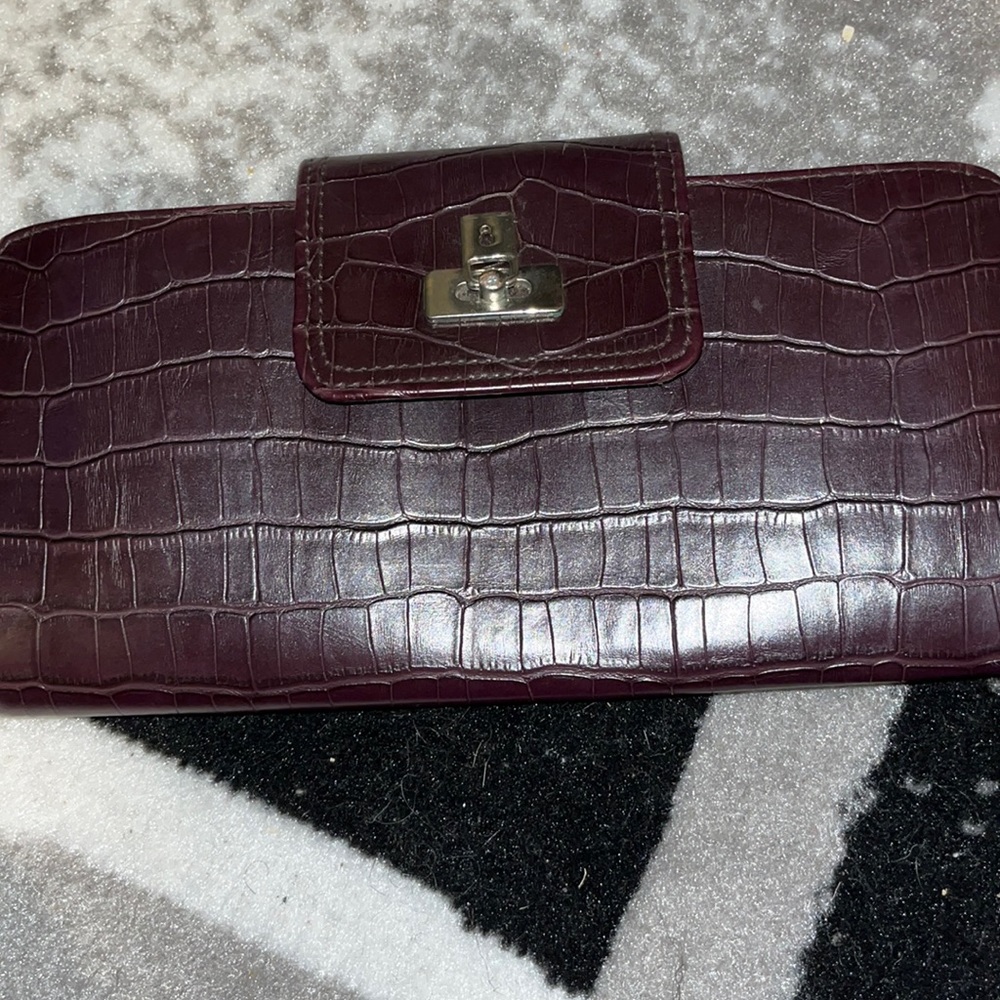 Never used. Never will. Wallet/clutch